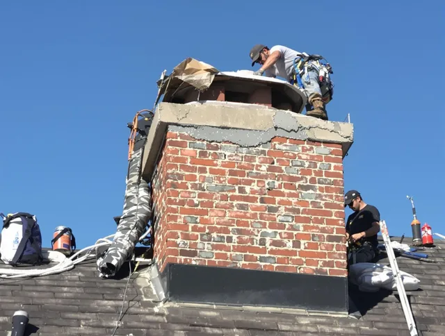 Killingly Chimney Sweep installing a custom chimney crown in Killingly, CT
