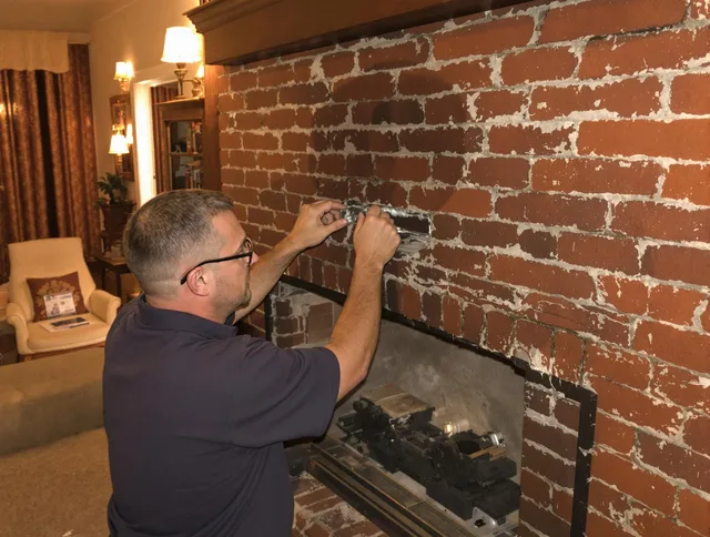 Killingly Chimney Sweep expert fixing a fireplace in Killingly, CT